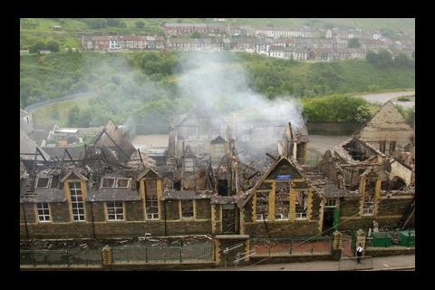 The smouldering ruins of Tylorstown primary school in Rhondda, south Wales, which was destroyed by arson in 2000